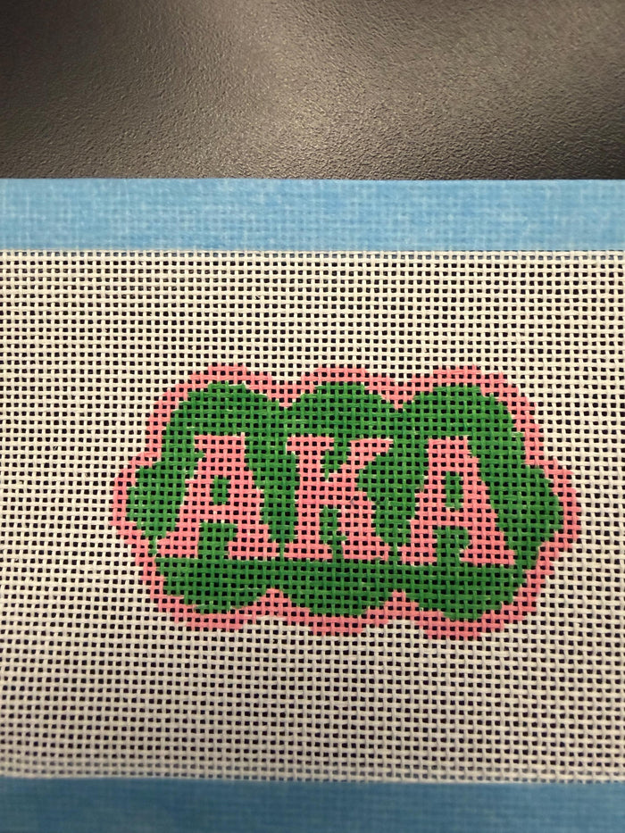 AKA pink and green needlepoint canvas