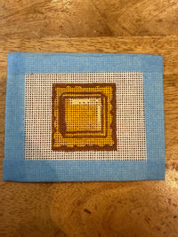 Geometric needlepoint canvas detail